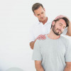 Perth chiropractor doing neck pain treatment to male patient