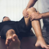 Man having a sports injury treatment on knee