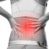 Woman's back needs lumbar and lower back pain treatment