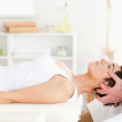 Woman lying down while having reflexology in Perth